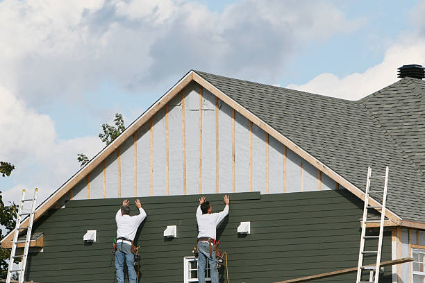 Professional Storm Damage Siding Repair technician working in Schuyler, VA